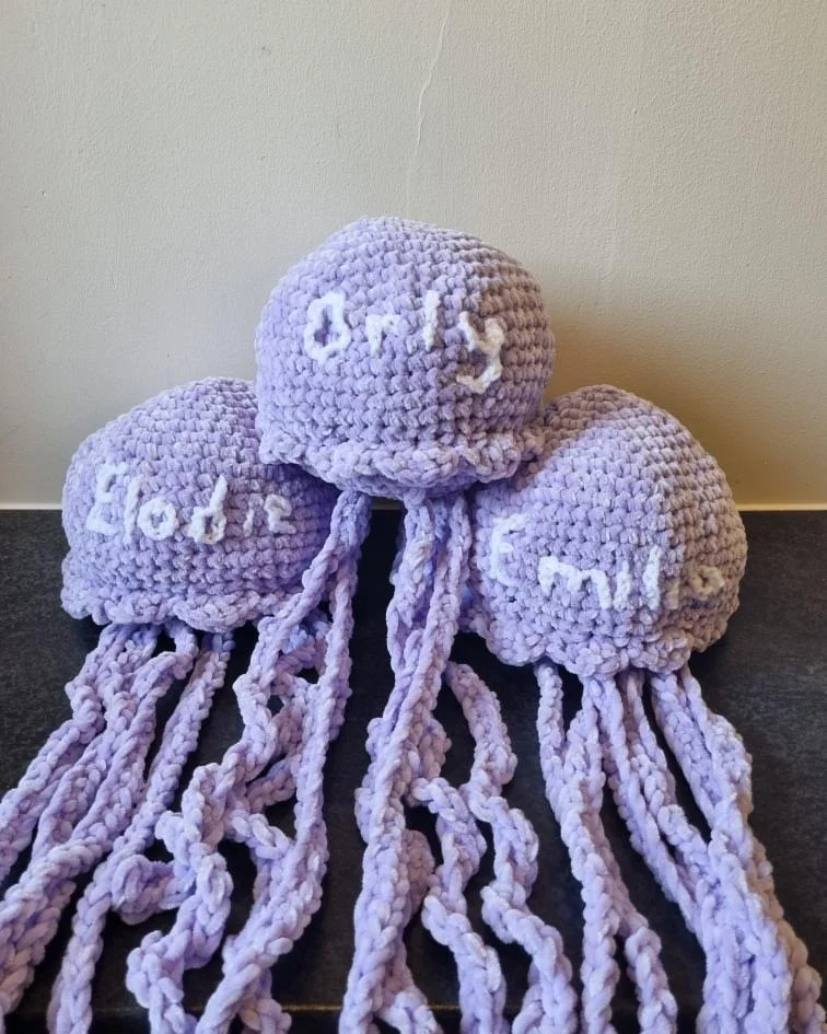 A crochet piece being made by hand